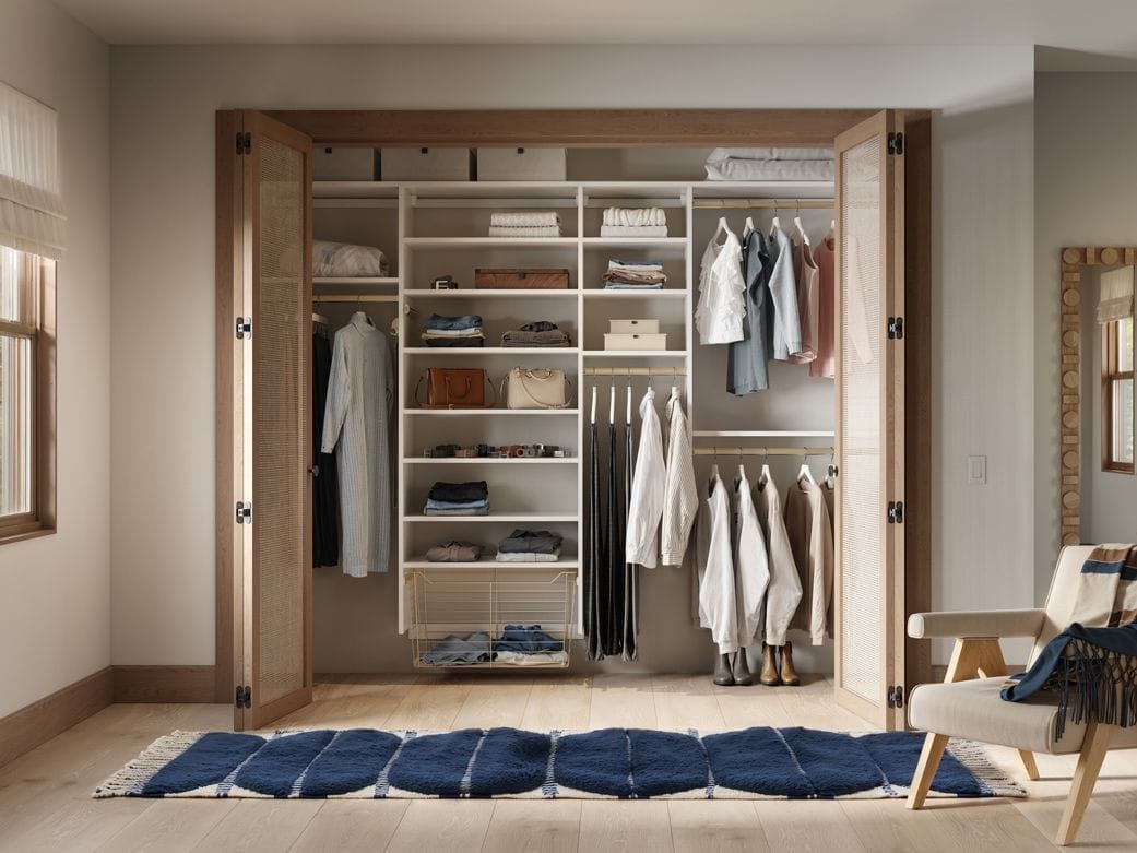 Reach in closet design, custom shelving, long and short hanging space by California Closets